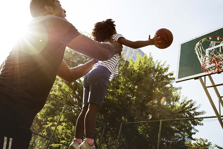 father daughter playing basketball 784x523 1