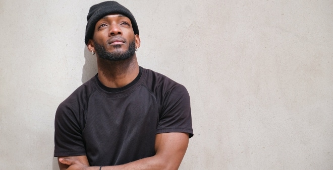 young black man looking hopeful