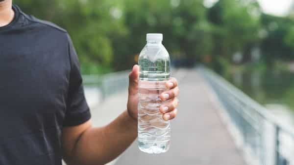 inline man holding water bottle